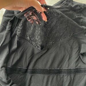 Black top with lace on the front
